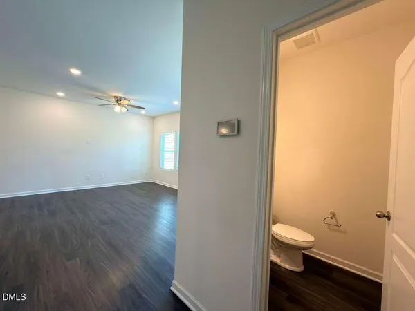a bathroom with a toilet sink and a mirror