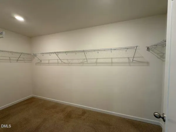 a view of a room with racks on the wall