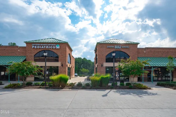 a front view of a building with street view