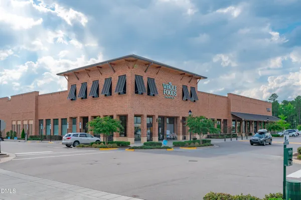 a group of people sitting in front of a building