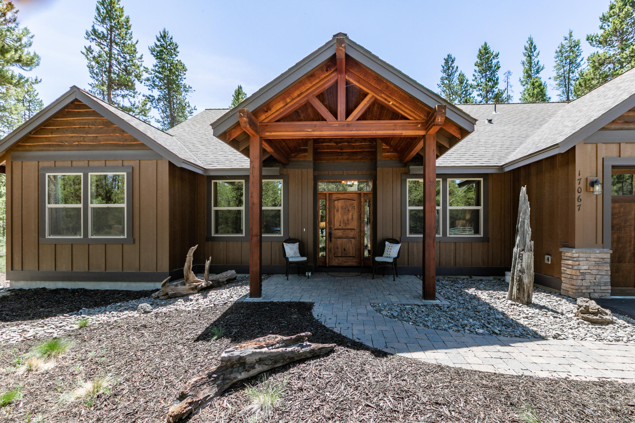 17067 Glendale Road Bend, OR 97707 - Photo 4 of 29 a front view of a house with garden