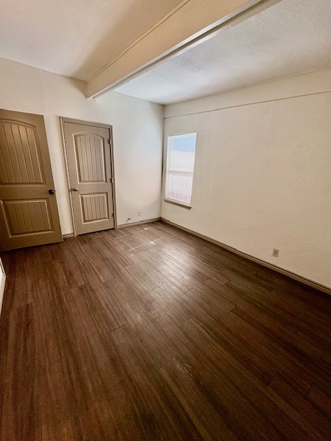 730 Sam Street Corpus Christi, TX 78411 - Photo 5 of 8 a view of an empty room with window and wooden floor