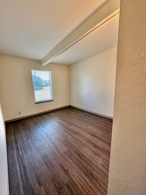 730 Sam Street Corpus Christi, TX 78411 - Photo 6 of 8 a view of an empty room with wooden floor and a window