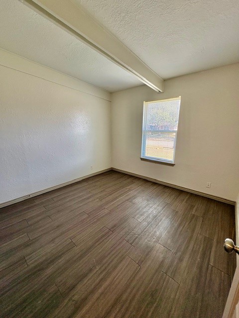 730 Sam Street Corpus Christi, TX 78411 - Photo 7 of 8 an empty room with wooden floor and windows