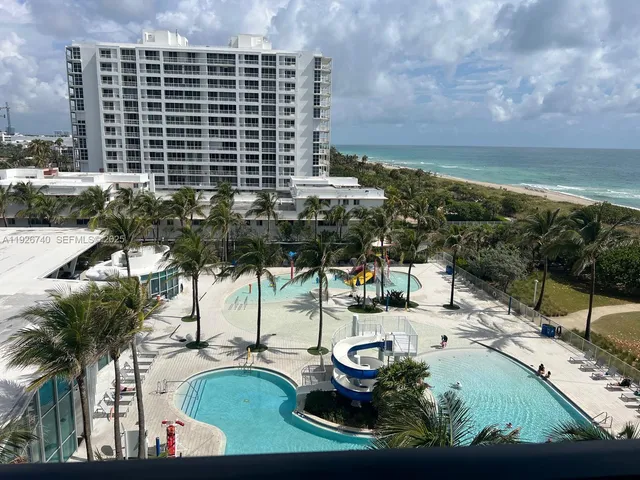 a view of a swimming pool with a patio
