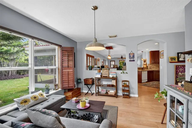 a view of a dining room with furniture window and wooden floor