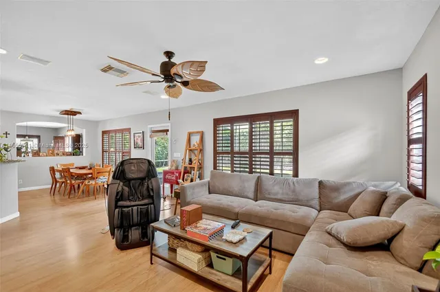 a living room with a couch and a window