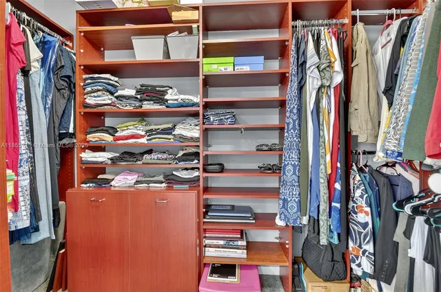a view of a livingroom with furniture and a window