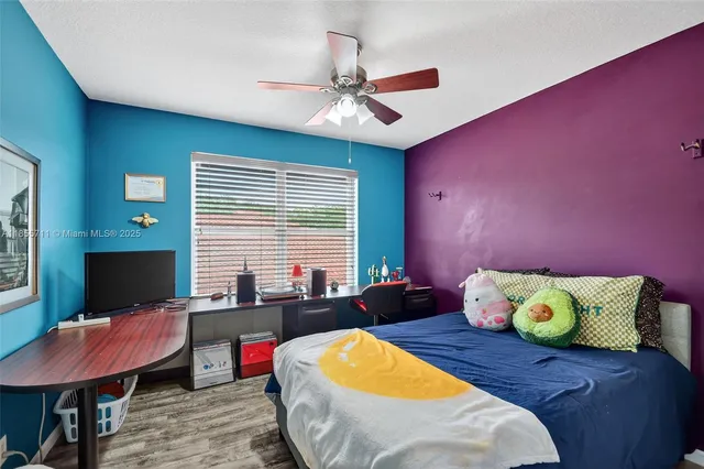 a bed room with a bed and a window