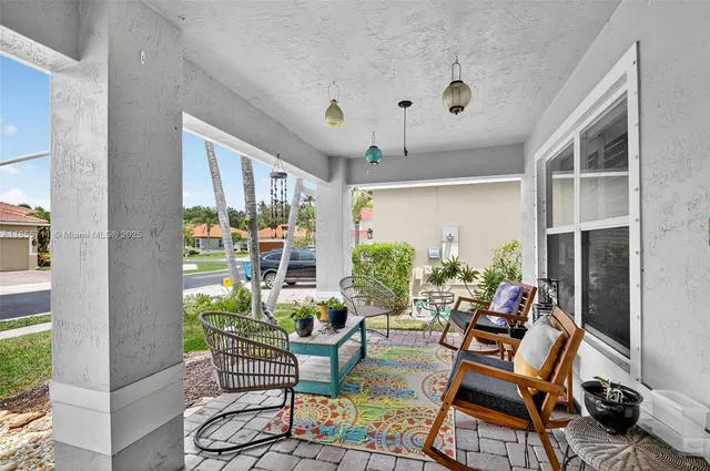 a dining room with furniture window and outside view