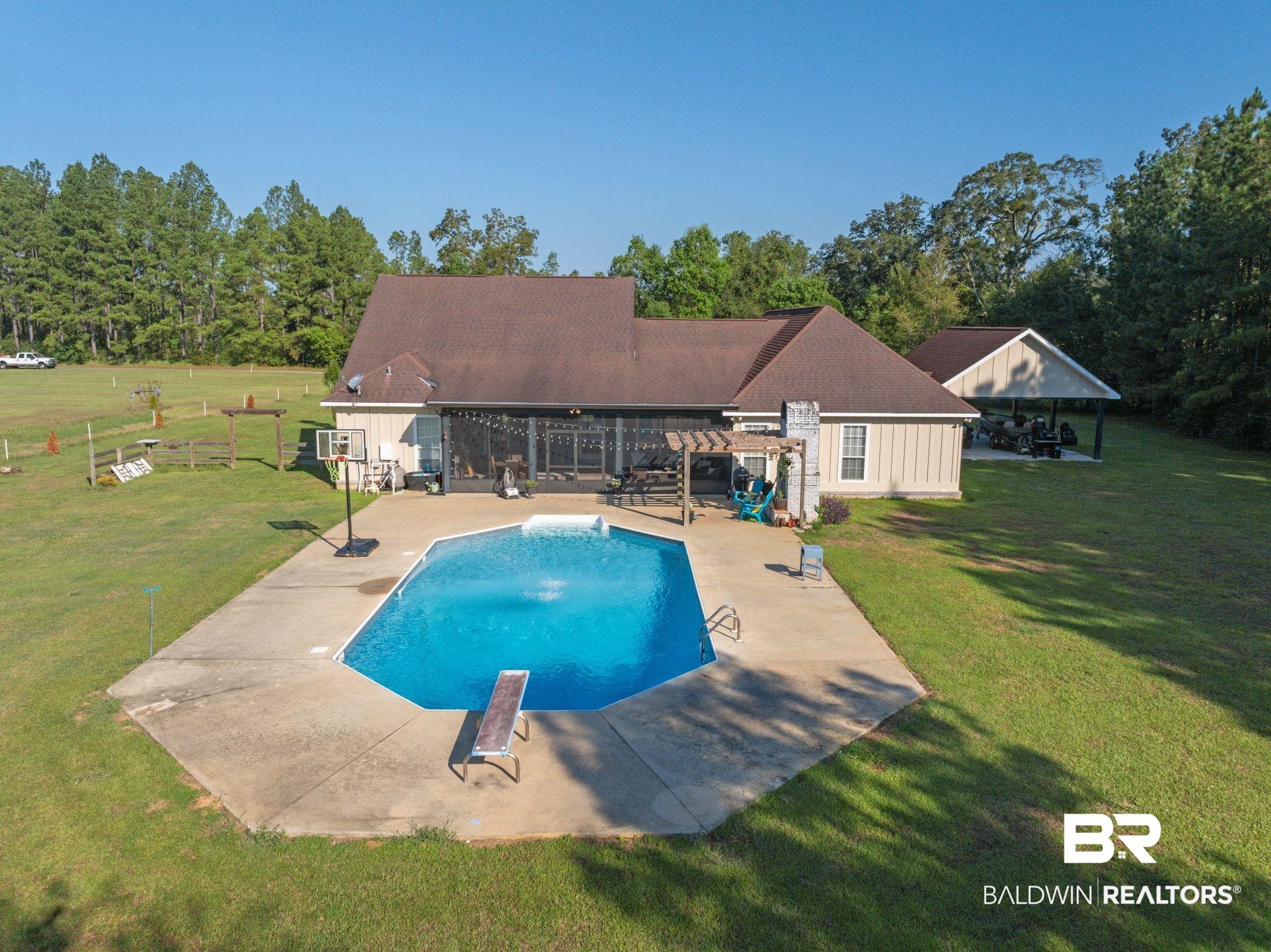 15635 North A N Brady Road Bay Minette, AL 36507 - Photo 43 of 51 View of swimming pool with a lawn, a patio, and a diving board