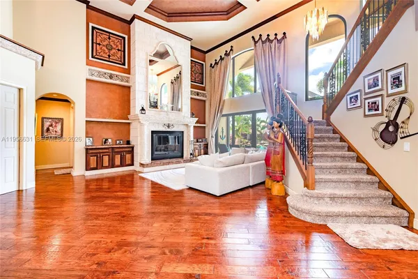 a kitchen with stainless steel appliances granite countertop a stove a sink and a microwave oven with cabinets