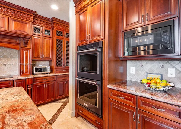 a spacious bedroom with a bed and wall painting