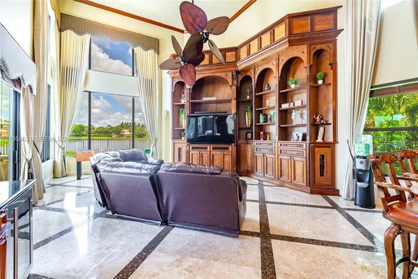 a view of a house with swimming pool and porch with furniture