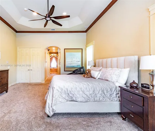 a view of a swimming pool with lounge chairs in patio