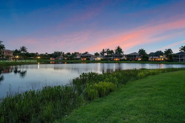 a view of living room with furniture and floor to ceiling windows