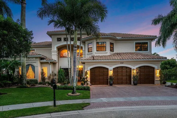 a bathroom with a granite countertop sink mirror vanity and a bathtub