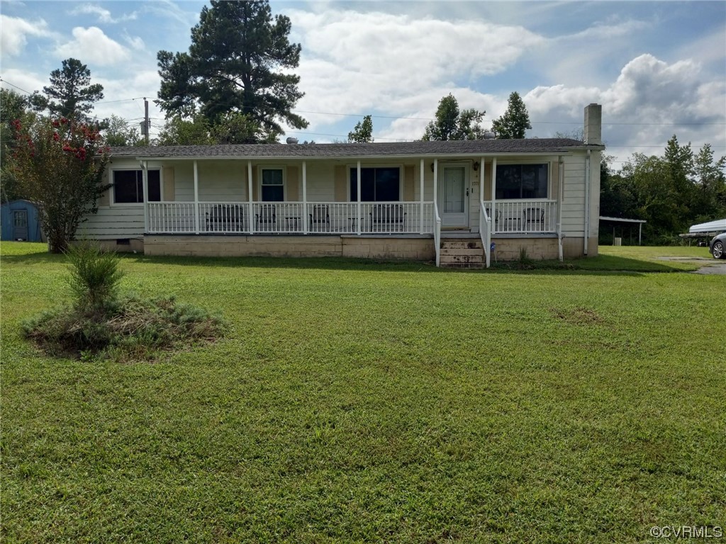 1701 Rocky Ford Road Crewe, VA 23930 - Photo 2 of 5 a view of a house with a backyard