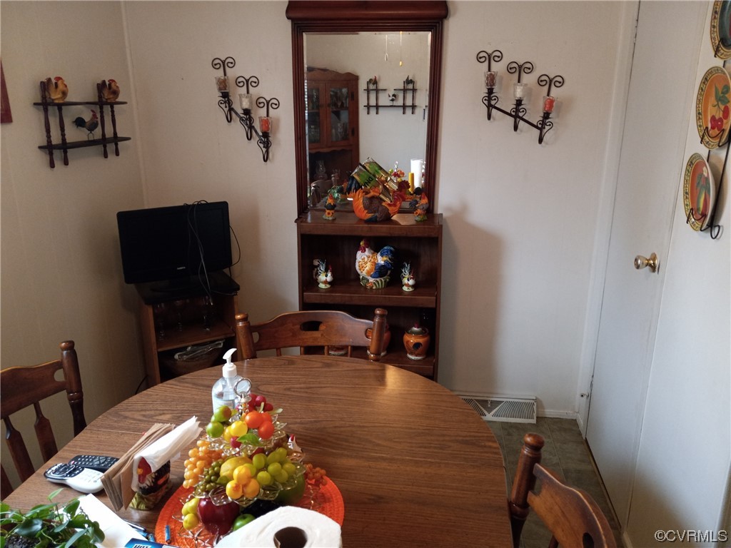 1701 Rocky Ford Road Crewe, VA 23930 - Photo 4 of 5 a living room with furniture and flowers