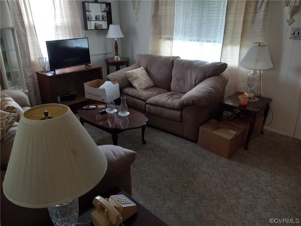 1701 Rocky Ford Road Crewe, VA 23930 - Photo 5 of 5 a living room with furniture and a flat screen tv