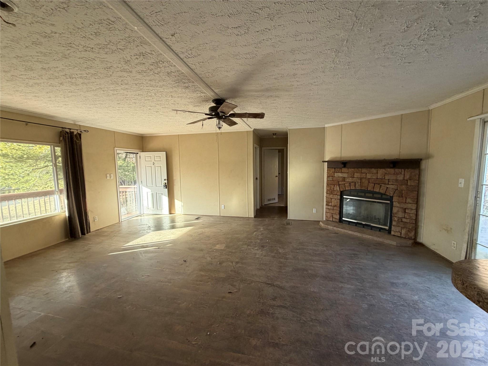 101 Highview Drive Maggie Valley, NC 28751 - Photo 2 of 29 an empty room with windows and fireplace