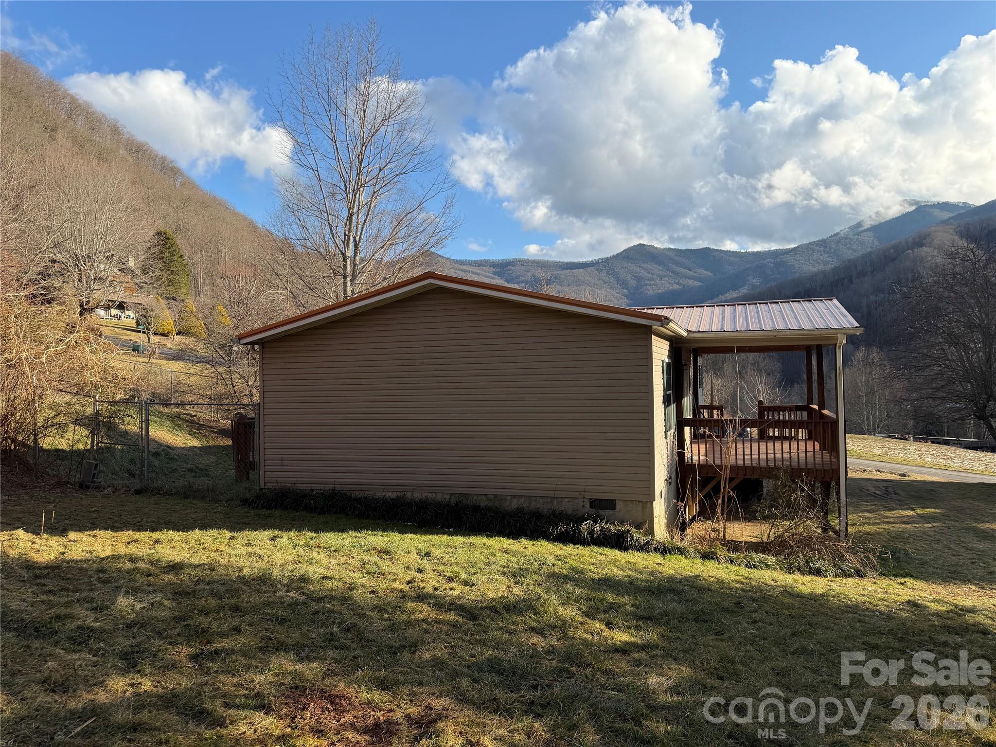 101 Highview Drive Maggie Valley, NC 28751 - Photo 28 of 29 a backyard of a house with wooden fence