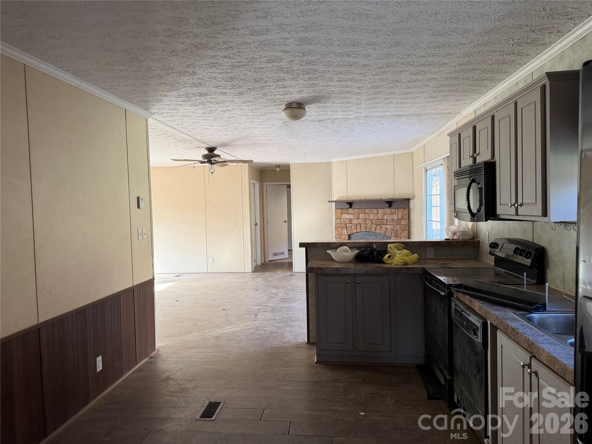 101 Highview Drive Maggie Valley, NC 28751 - Photo 5 of 29 a kitchen with a sink a stove and cabinets
