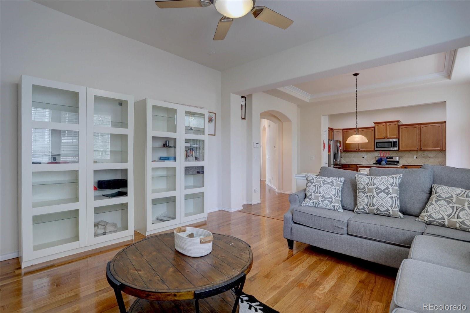 5300 Fullerton Lane Highlands Ranch, CO 80130 - Photo 11 of 31 a living room with furniture and a wooden floor