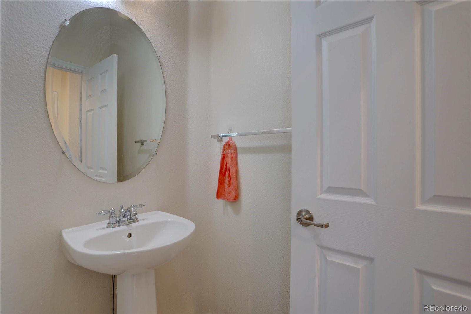 5300 Fullerton Lane Highlands Ranch, CO 80130 - Photo 12 of 31 a bathroom with a sink and a mirror