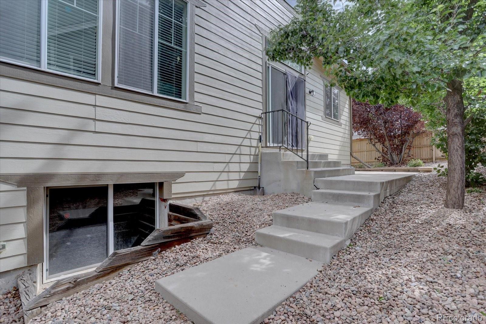 5300 Fullerton Lane Highlands Ranch, CO 80130 - Photo 26 of 31 a view of a house with a yard