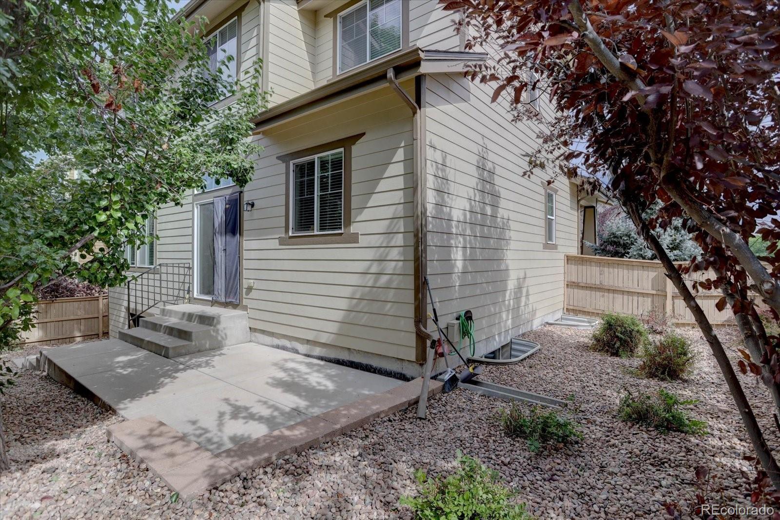 5300 Fullerton Lane Highlands Ranch, CO 80130 - Photo 28 of 31 a view of a house with backyard and trees