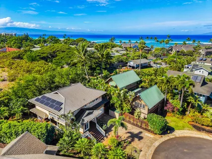 an aerial view of a house with a yard swimming pool outdoor seating and yard