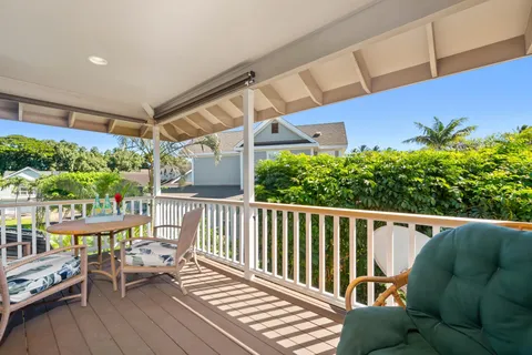 a view of balcony with furniture and garden