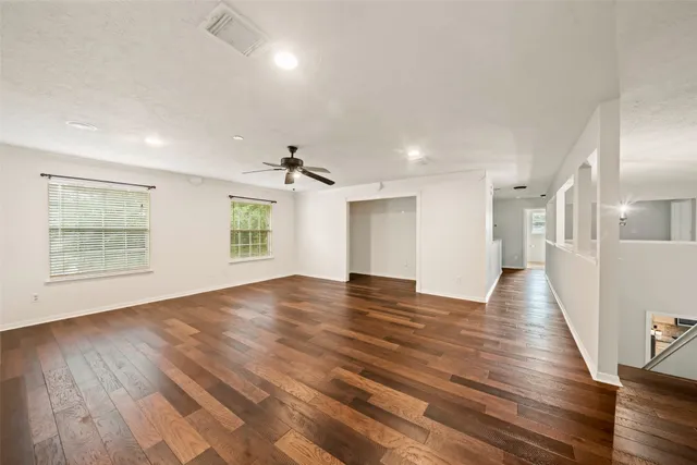 a view of a livingroom with wooden floor