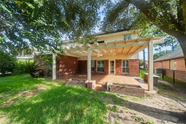 a view of a park with large trees