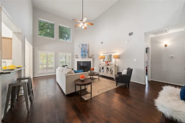 a living room with furniture and a fireplace