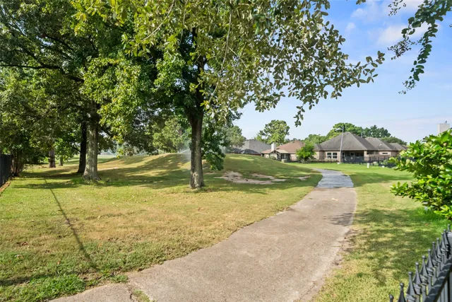 an aerial view of a house with garden space and street view