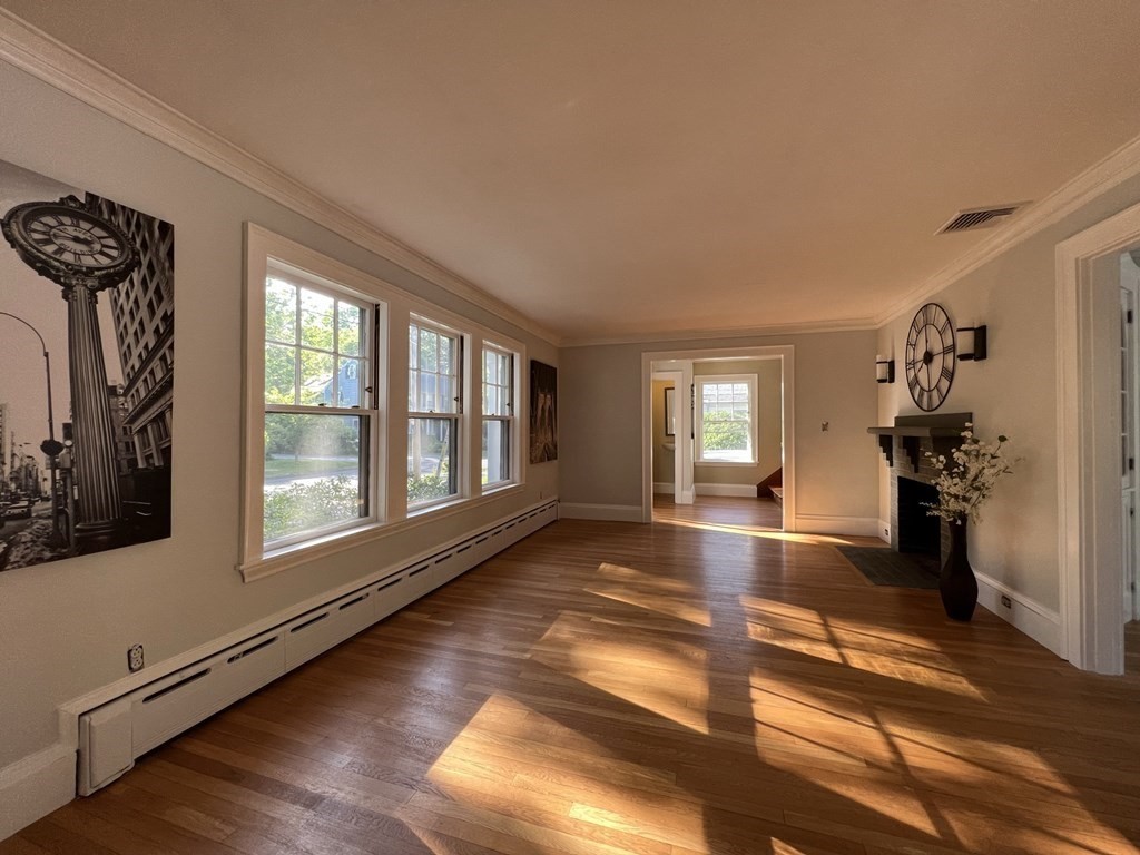 55 Forest Street Lexington, MA 02421 - Photo 8 of 39 a view of a livingroom with wooden floor and furniture