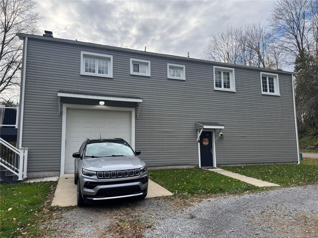 704 Rose Point-Harlansburg Road New Castle, PA 16101 - Photo 1 of 1 a car parked in front of a house