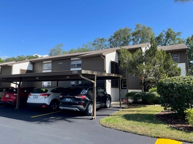 4008 Passport Lane, Unit 203 New Port Richey, FL 34653 - Photo 1 of 1 a view of a car parked in front of a house