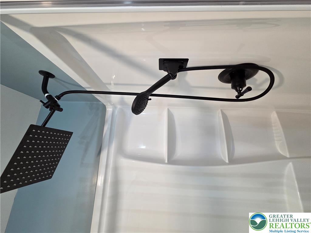 89 Short Ridge Road Albrightsville, PA 18210 - Photo 50 of 71 A modern shower setup features a dual-head system in matte black finishes.