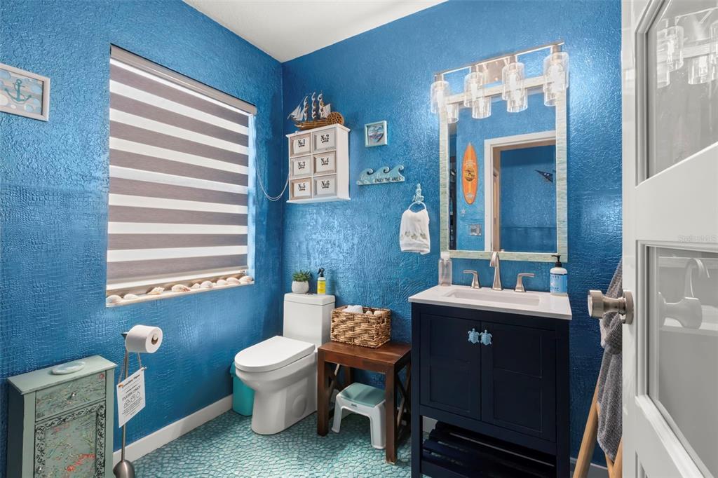 16333 Gulf Boulevard, Unit 113 Redington Beach, FL 33708 - Photo 15 of 40 a living room with furniture and a toilet