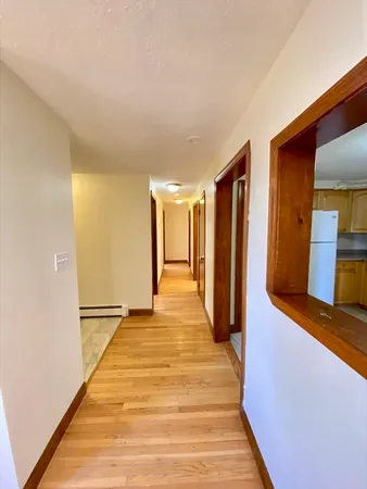 a view of a living room with a wooden floor