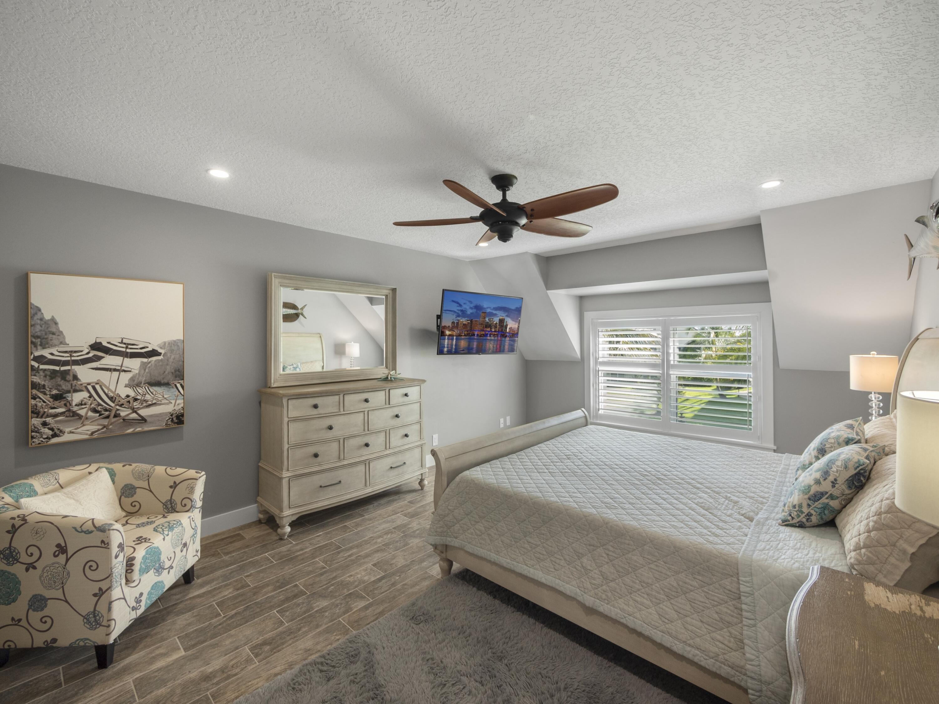 4161 U.S. Highway 1, Unit C3 Jupiter, FL 33477 - Photo 16 of 34 a bedroom with a bed and a window