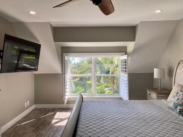 4161 U.S. Highway 1, Unit C3 Jupiter, FL 33477 - Photo 17 of 34 a bedroom with a bed and a large window