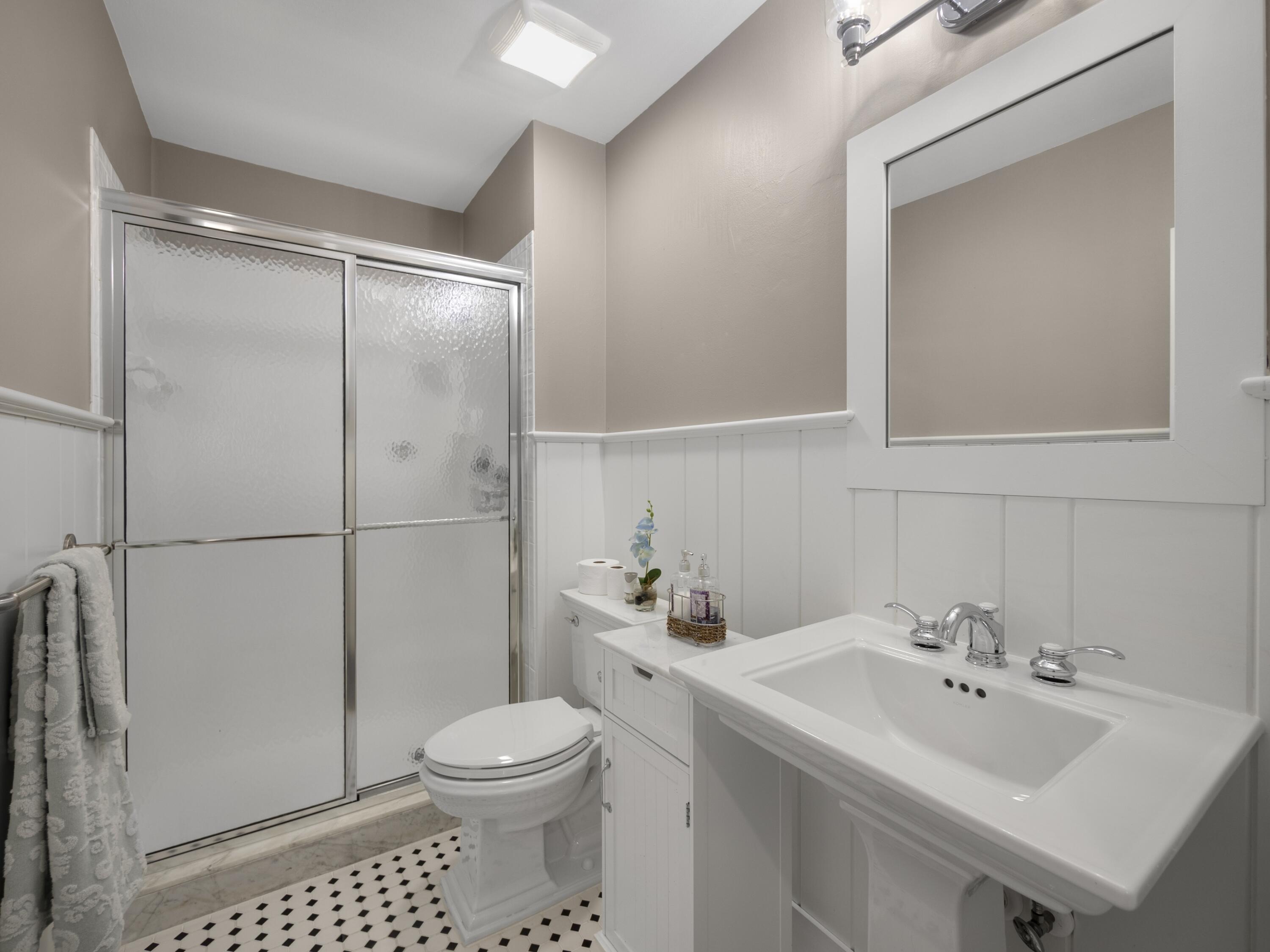 4161 U.S. Highway 1, Unit C3 Jupiter, FL 33477 - Photo 23 of 34 a bathroom with a sink toilet and shower