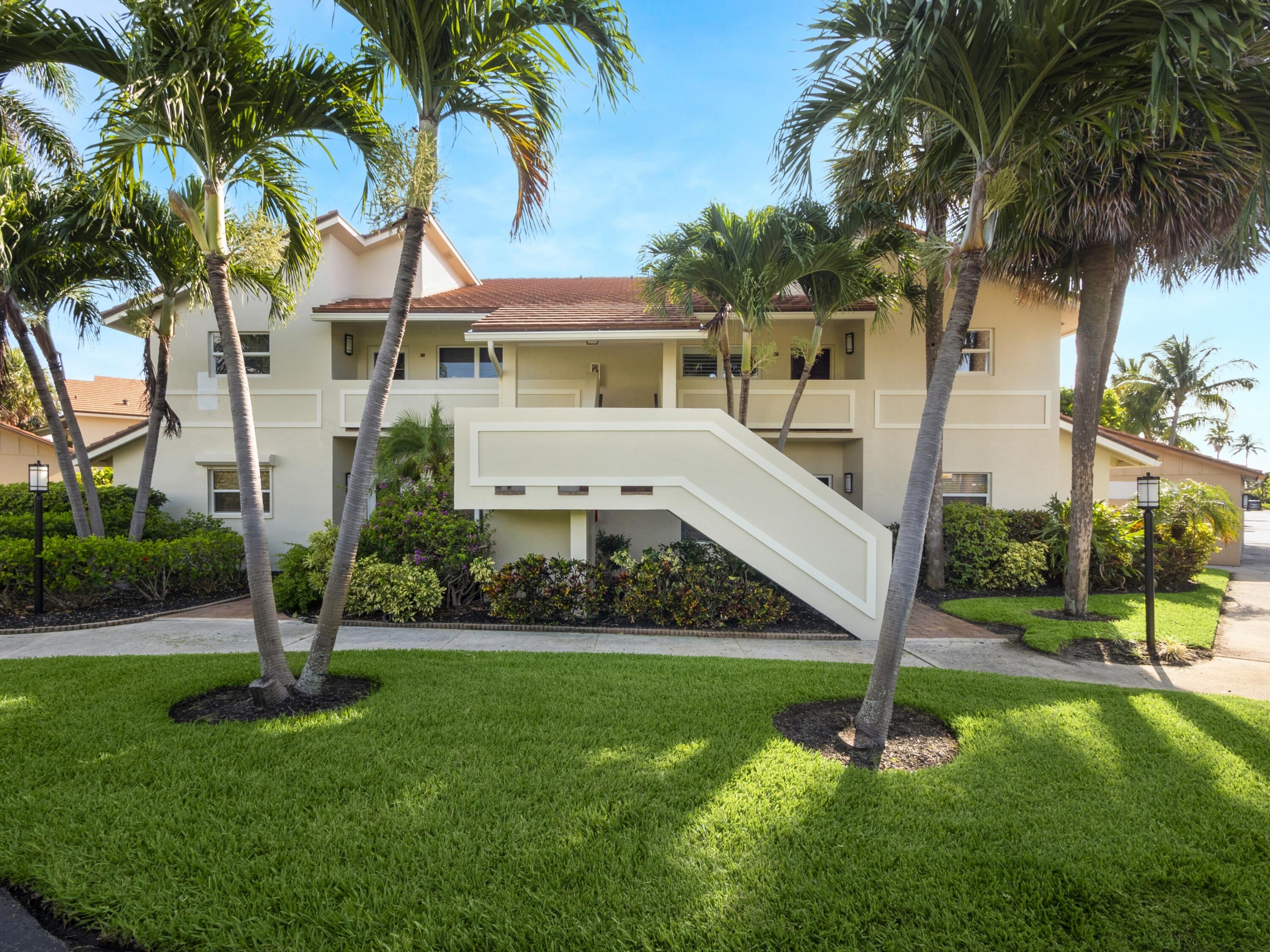 4161 U.S. Highway 1, Unit C3 Jupiter, FL 33477 - Photo 6 of 34 a front view of a house with garden