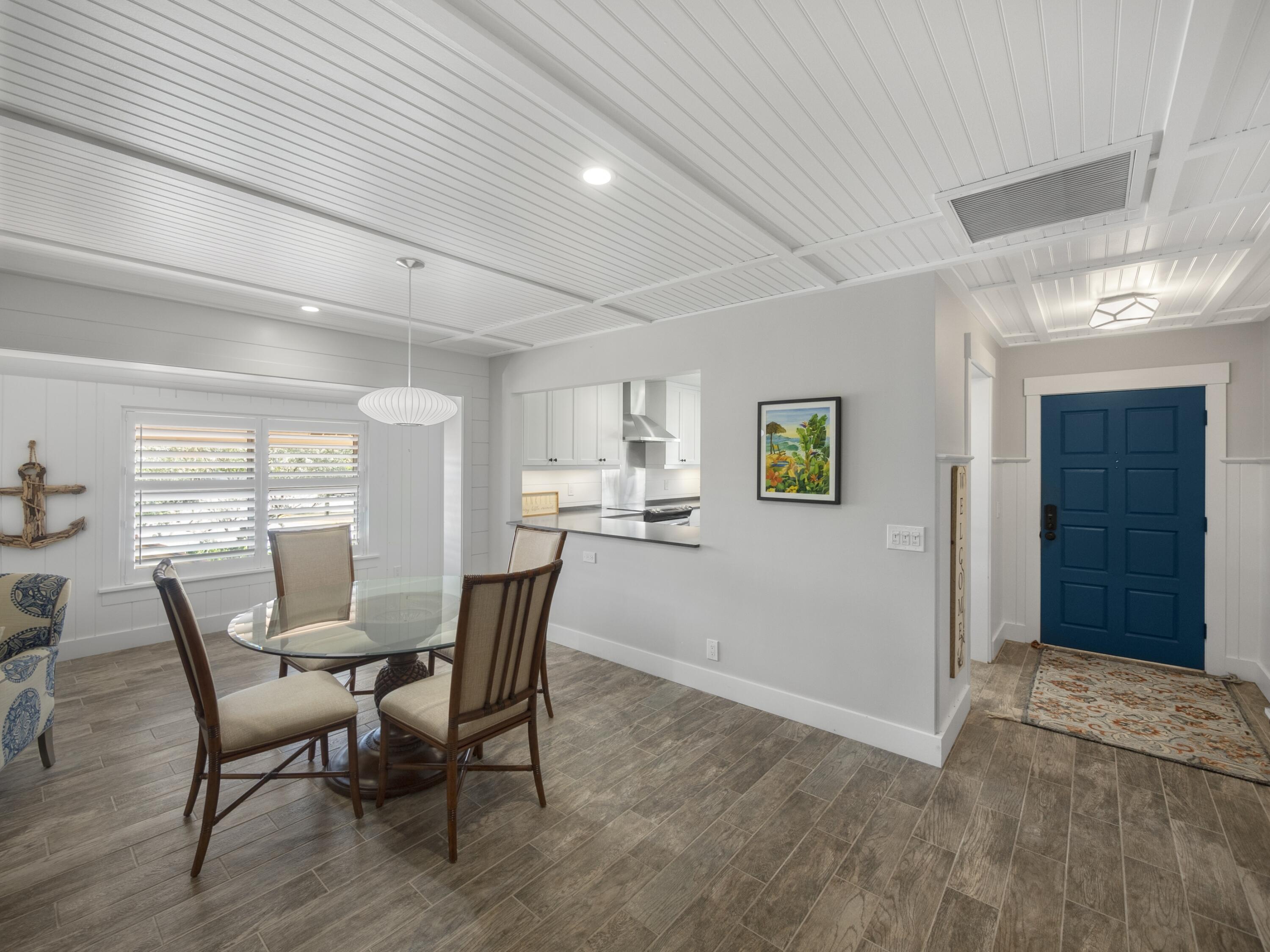 4161 U.S. Highway 1, Unit C3 Jupiter, FL 33477 - Photo 8 of 34 a view of a dining room with furniture and window