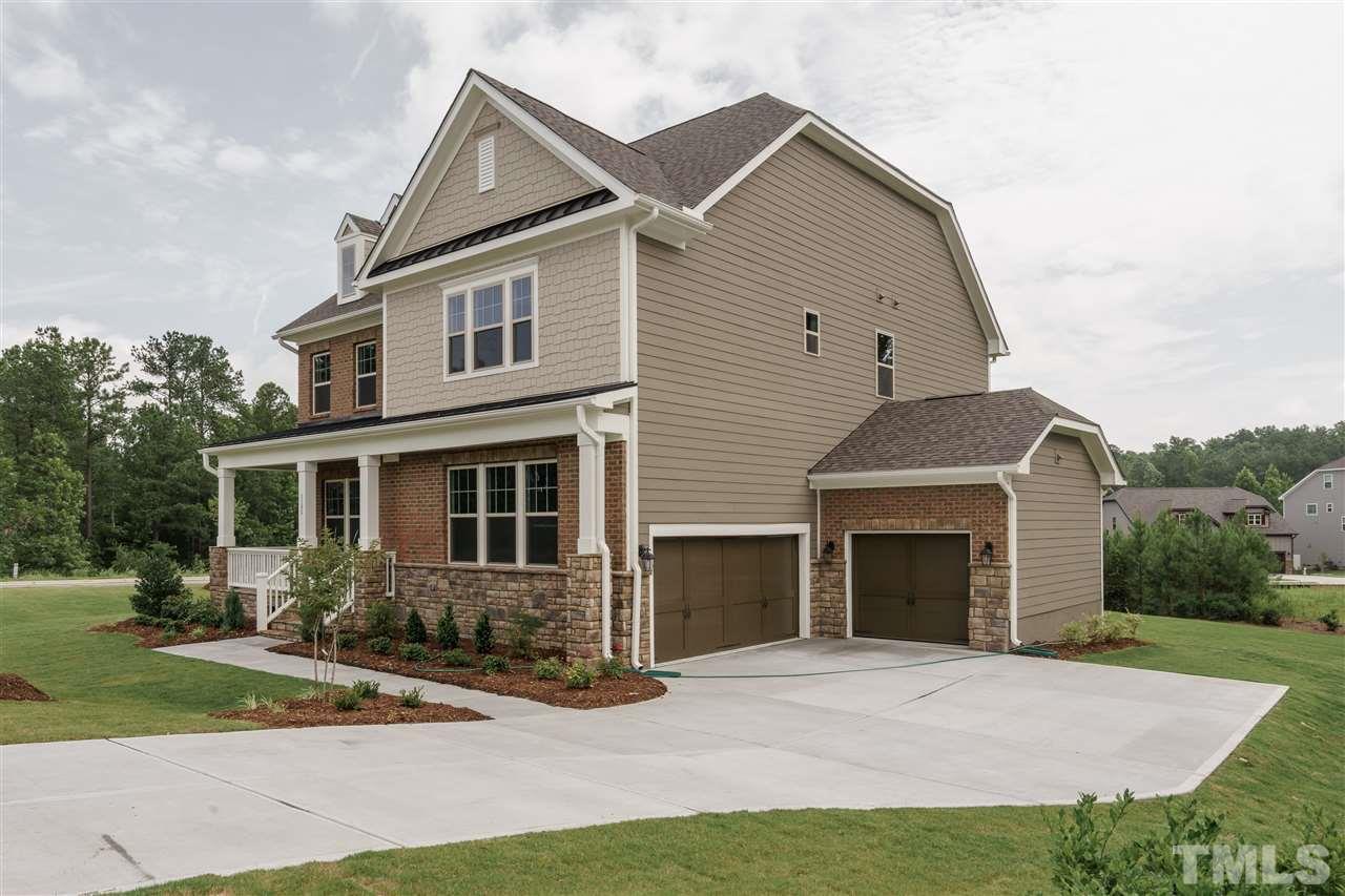 5117 Landguard Drive Raleigh, NC 27613 - Photo 1 of 2 a front view of a house with a yard and garage