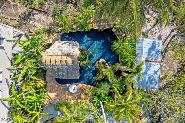 a view of a house with a tree